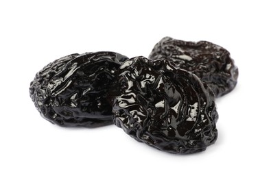 Photo of Sweet dried prunes on white background. Healthy snack