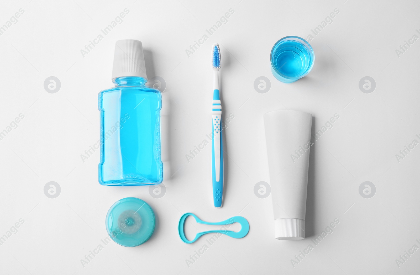 Photo of Flat lay composition with toothpaste and oral hygiene products on white background