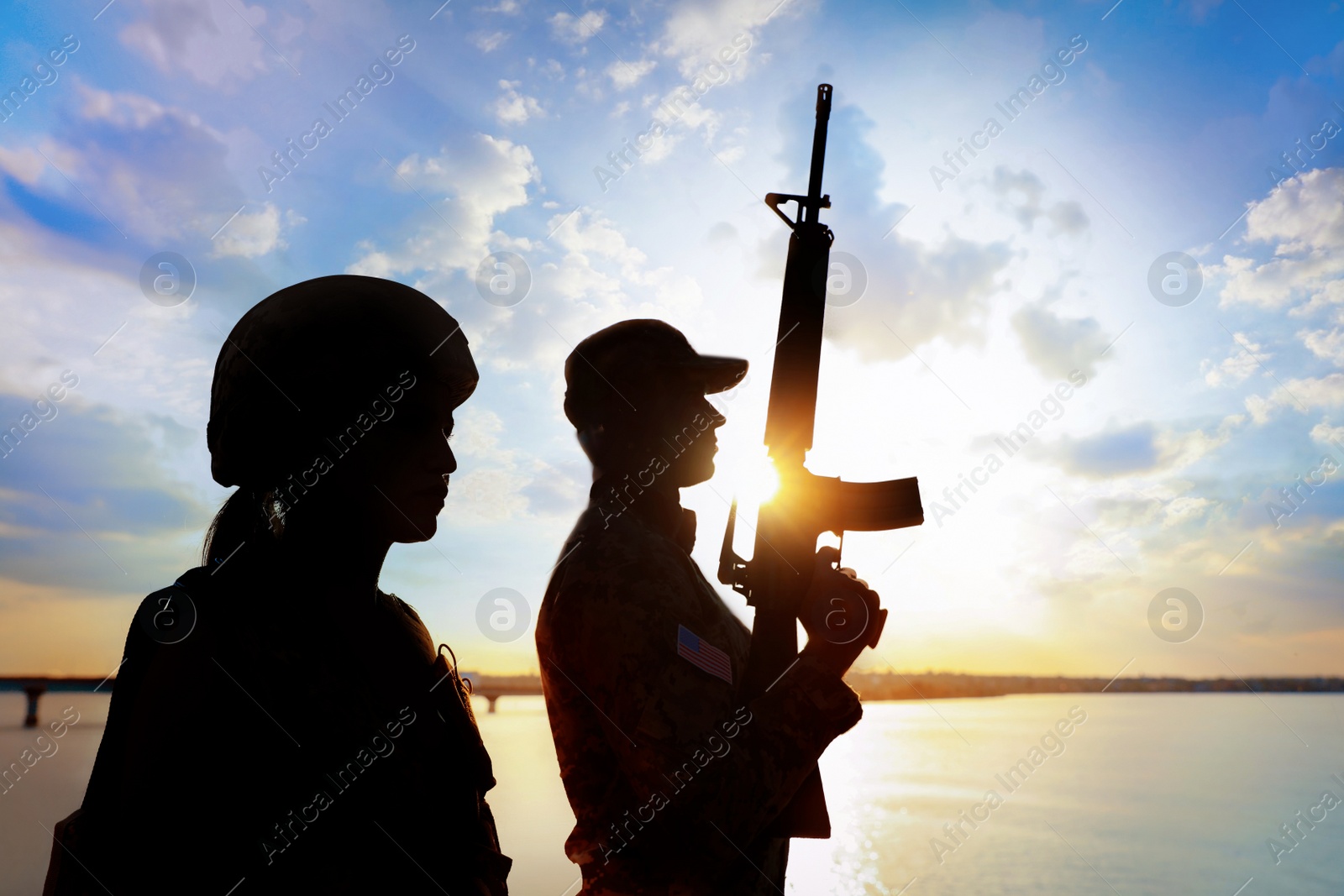 Photo of Soldiers in uniform patrolling outdoors. Military service