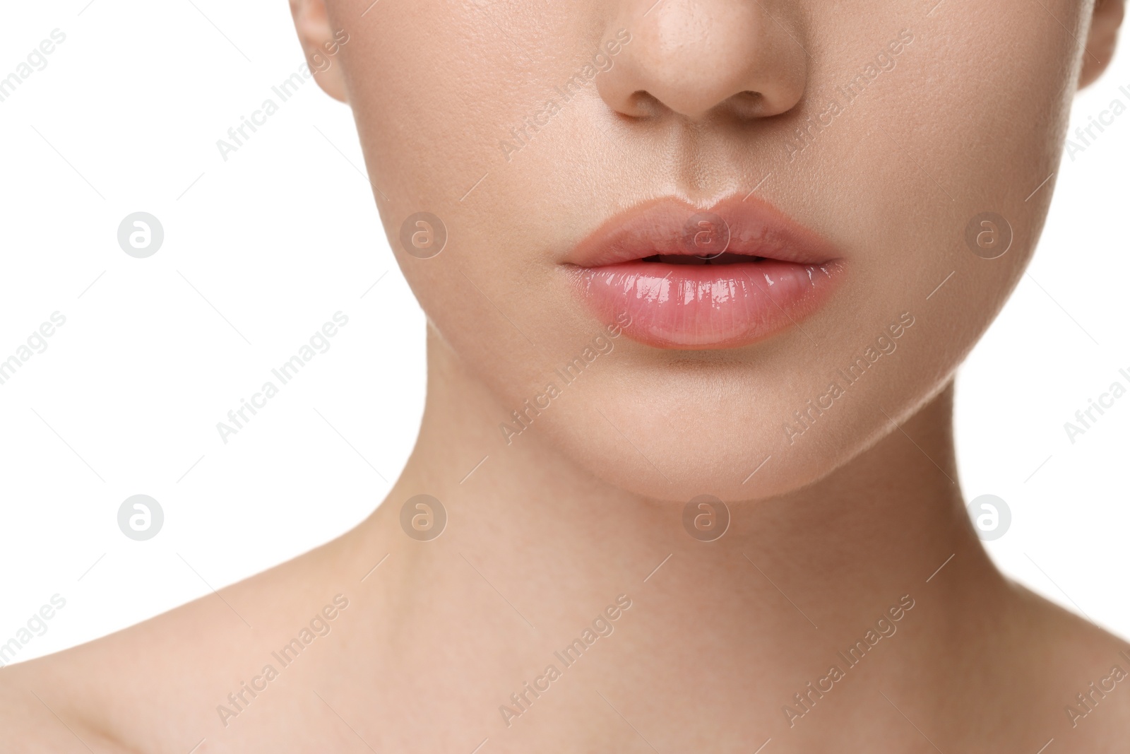 Photo of Woman wearing beautiful lip gloss on white background, closeup