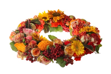 Beautiful autumnal wreath with flowers, berries and fruits isolated on white