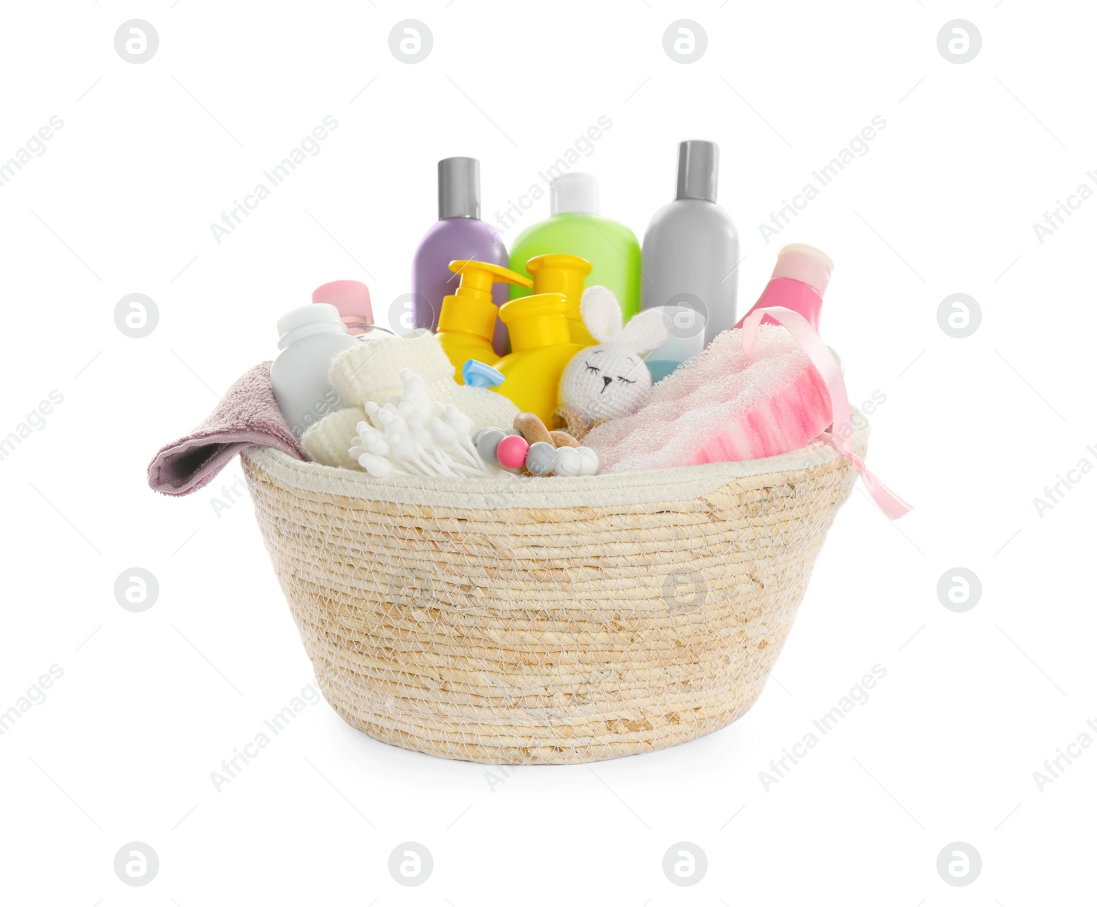 Photo of Wicker basket full of different baby cosmetic products, bathing accessories and toys on white background