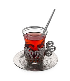 Photo of Glass of traditional Turkish tea in vintage holder isolated on white