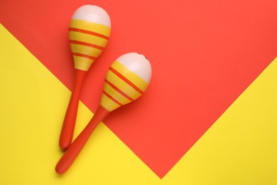 Photo of Maracas on colorful background, flat lay with space for text. Musical instrument