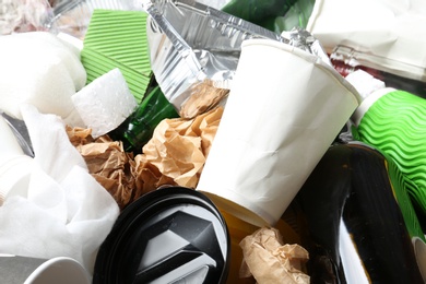 Photo of Pile of different garbage as background. Recycling problem