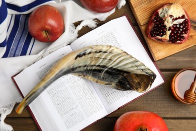 Photo of Flat lay composition with Rosh Hashanah holiday symbols on wooden table