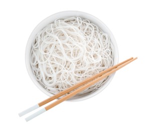 Photo of Bowl with cooked rice noodles and chopsticks isolated on white, top view