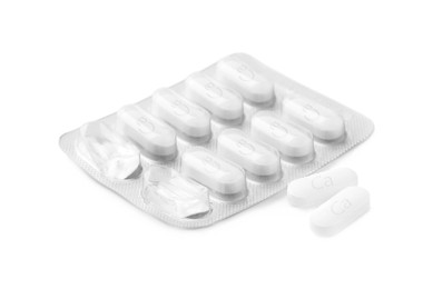 Photo of Blister pack with calcium supplement pills on white background