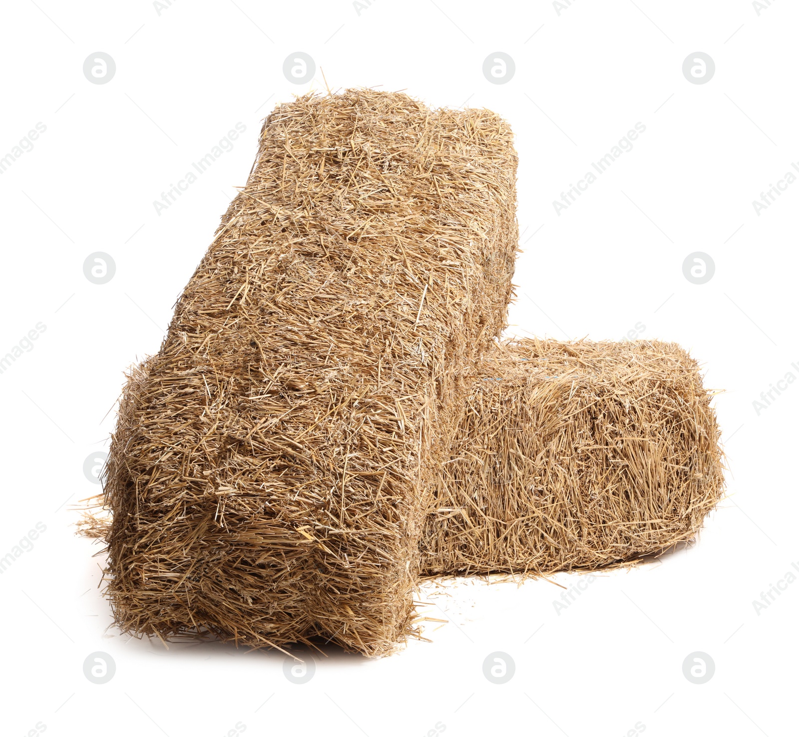 Photo of Bales of dried straw isolated on white