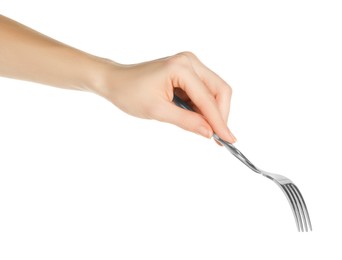 Woman holding shiny silver fork on white background, closeup