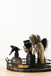 Set of hairdresser tools on table in salon