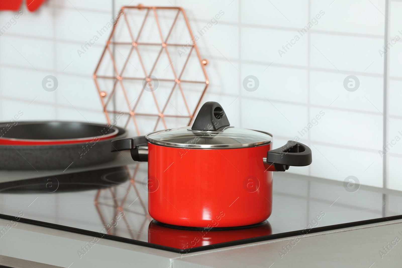 Photo of Clean pan on modern stove in kitchen