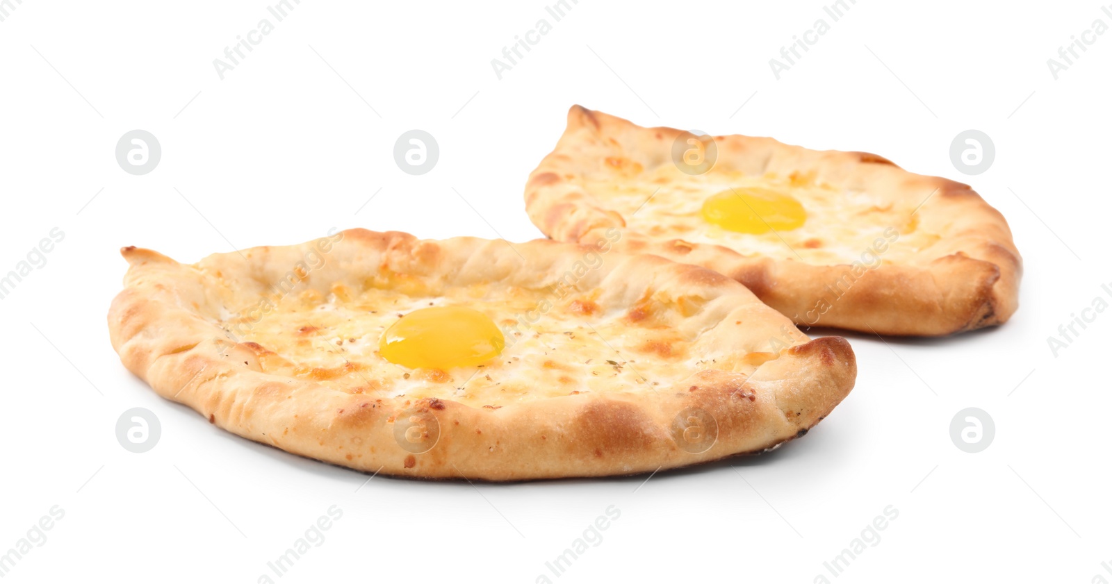 Photo of Fresh delicious Adjarian khachapuris on white background