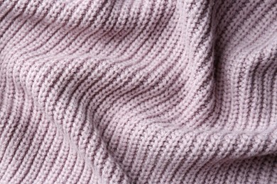 Beautiful violet knitted fabric as background, top view