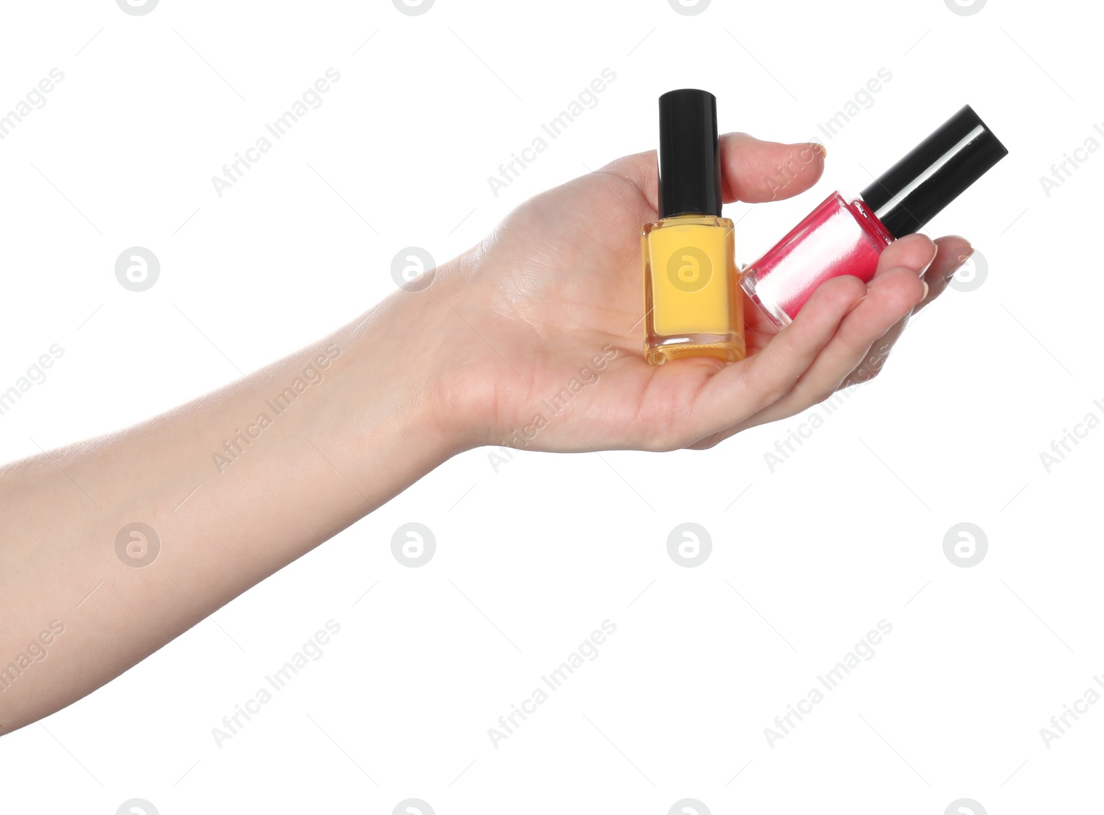 Photo of Woman holding nail polishes on white background, closeup