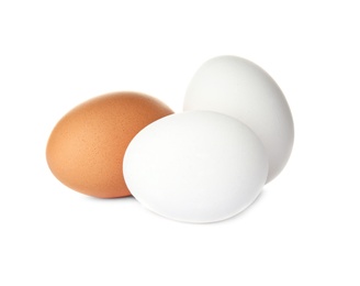 Photo of Few raw chicken eggs on white background