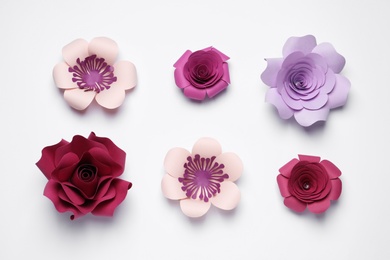 Photo of Different beautiful flowers made of paper on white background, top view