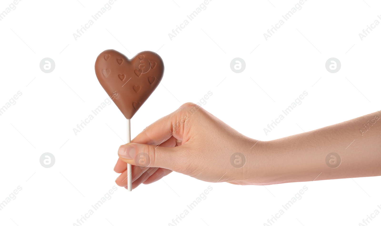 Photo of Woman holding heart shaped lollipops made of chocolate on white background, closeup