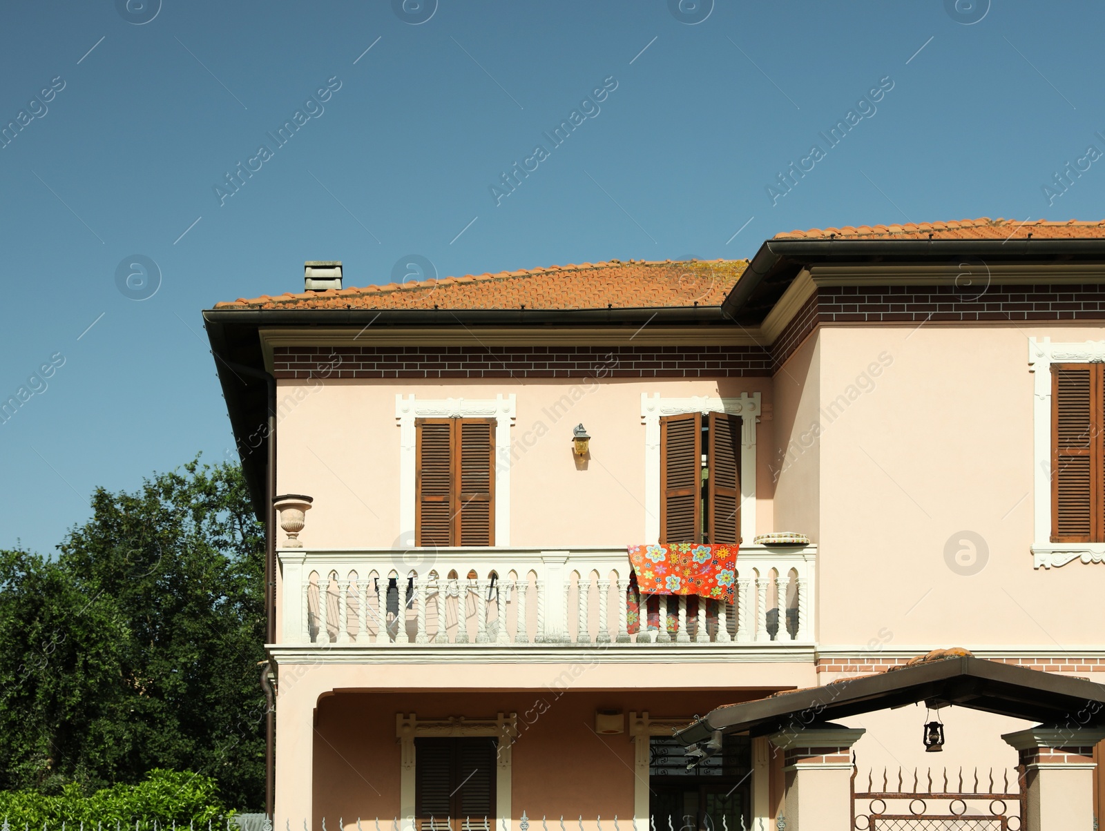 Photo of Beautiful residential building with balcony on sunny day