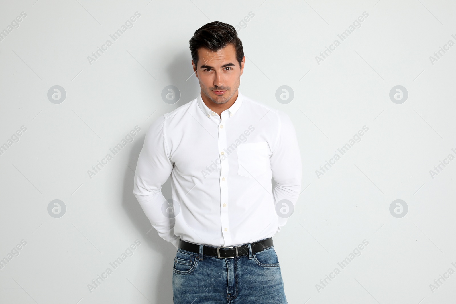 Photo of Portrait of handsome young man on light background