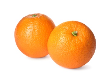 Photo of Delicious fresh ripe oranges on white background