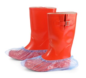 Rubber boots in blue shoe covers isolated on white