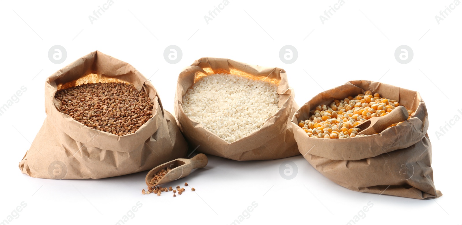 Photo of Paper bags with different types of grains and cereals on white background