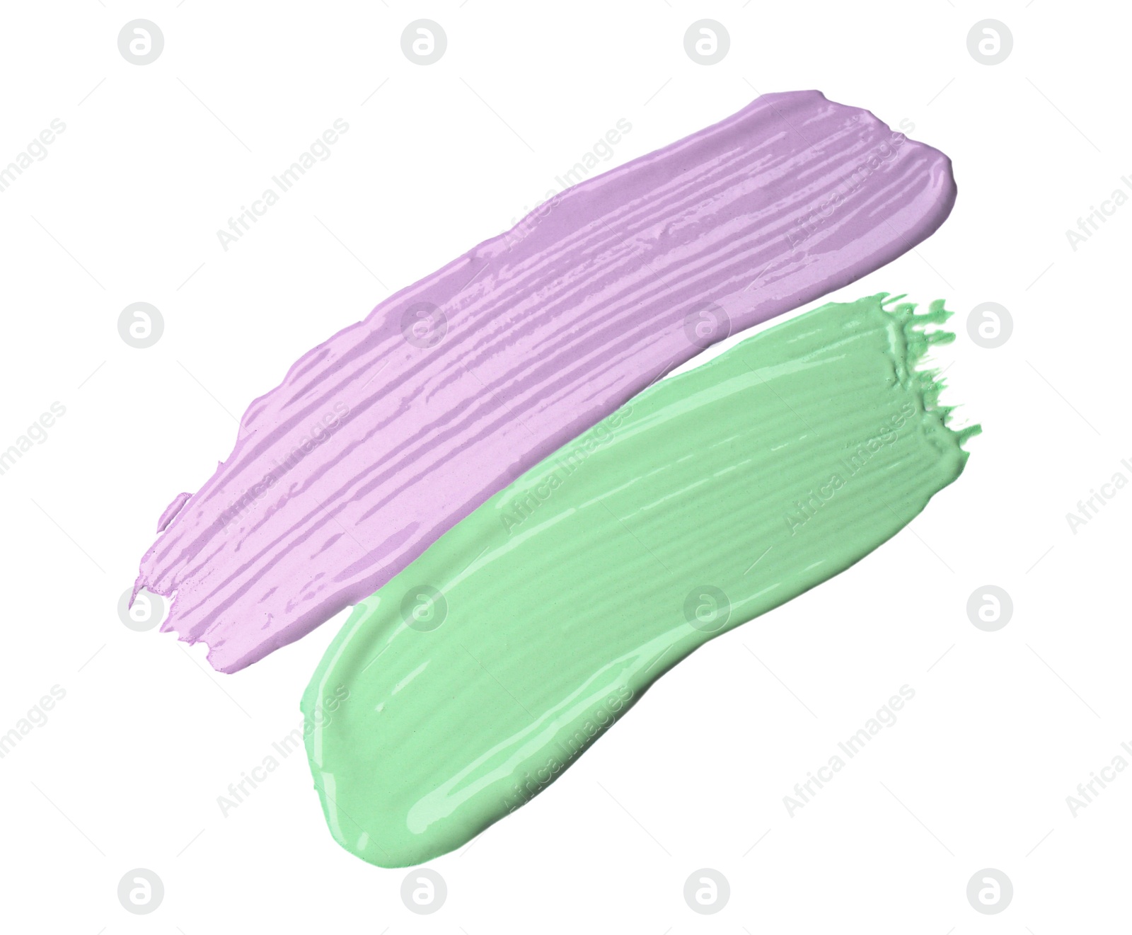 Photo of Strokes of different color correcting concealers isolated on white