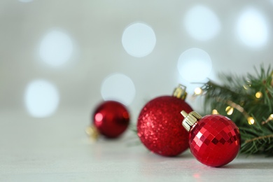 Christmas decorations on table against blurred background, space for text. Bokeh effect
