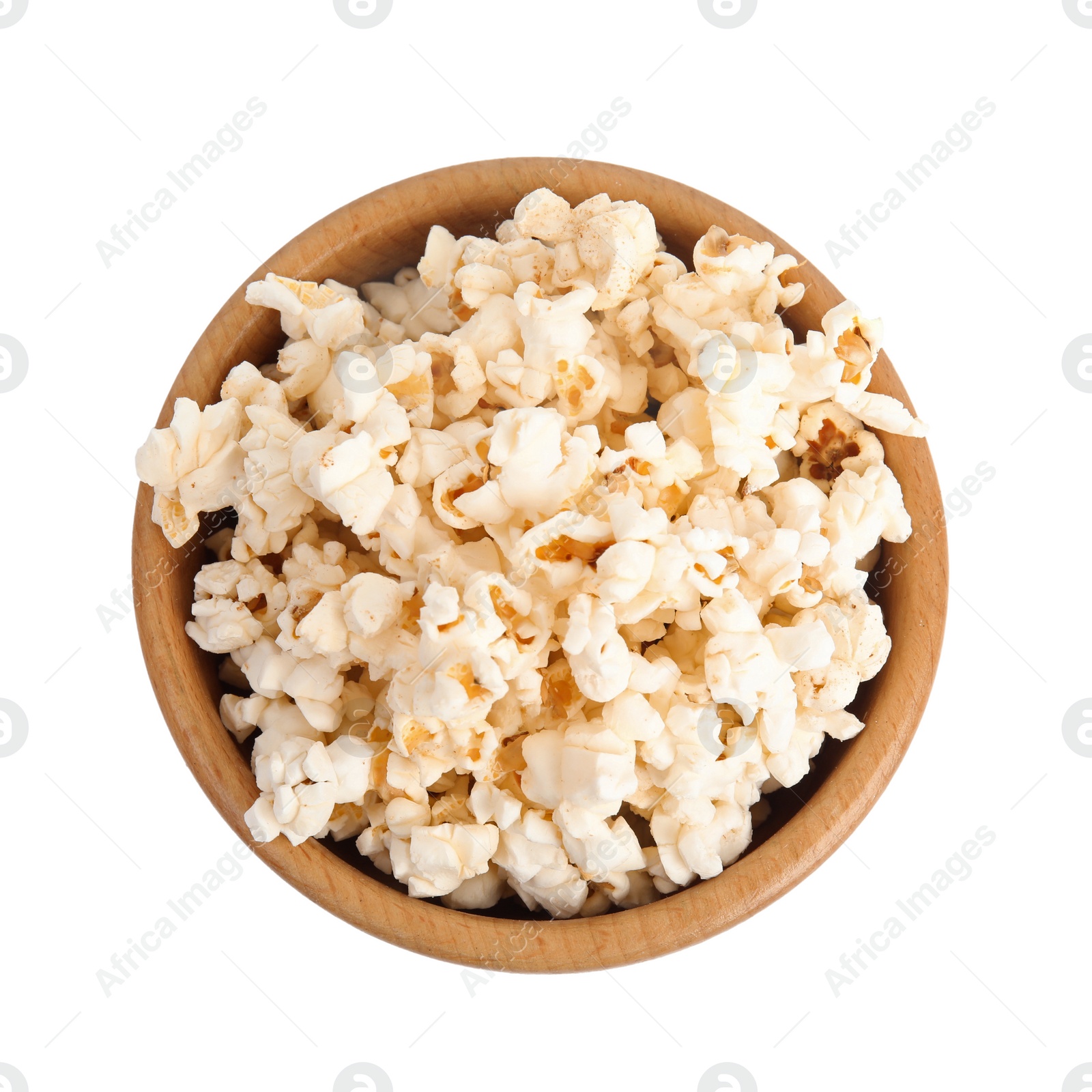 Photo of Wooden bowl of tasty pop corn isolated on white, top view