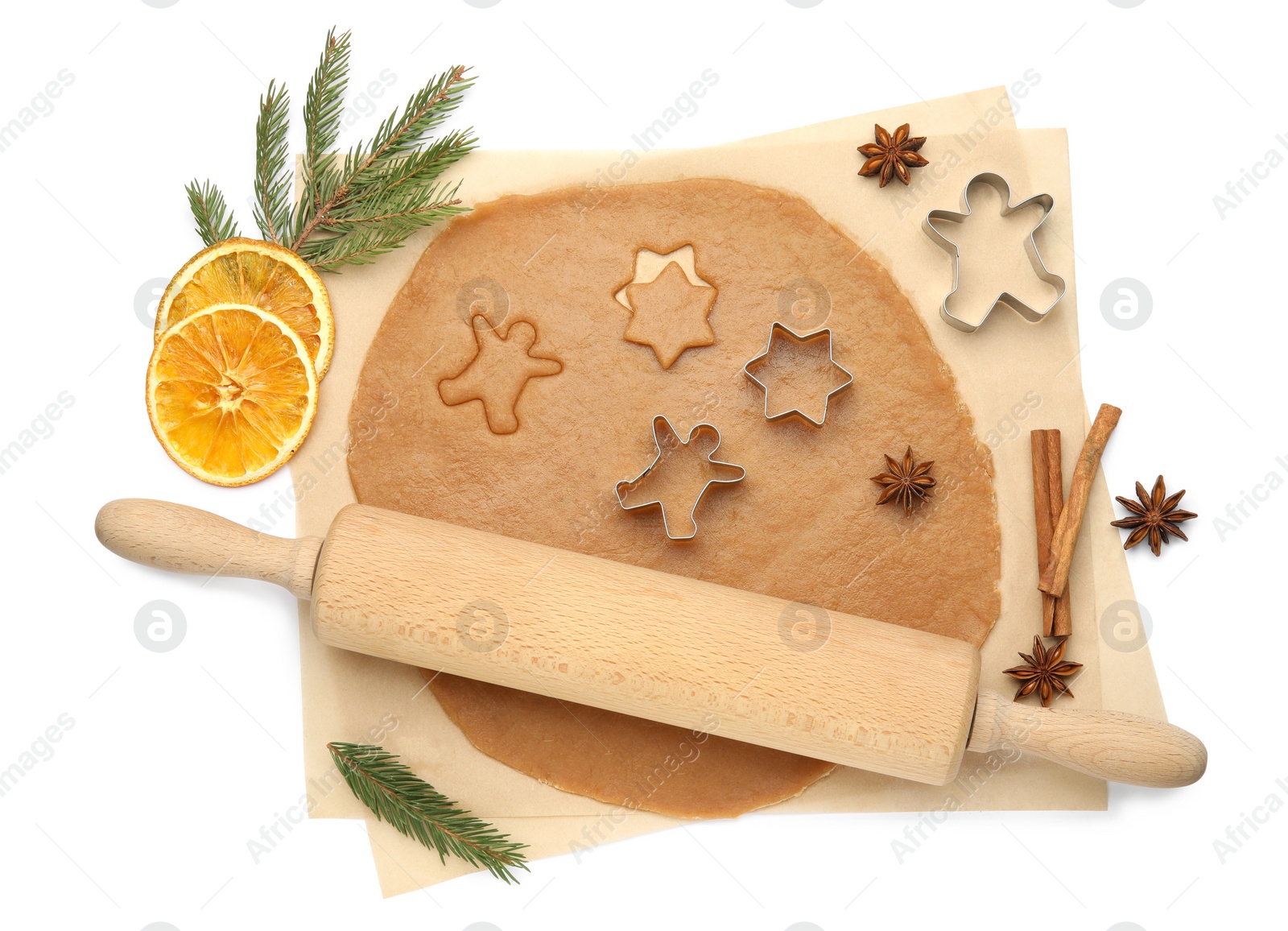 Photo of Composition with dough and cookie cutters on white background, top view. Christmas biscuits