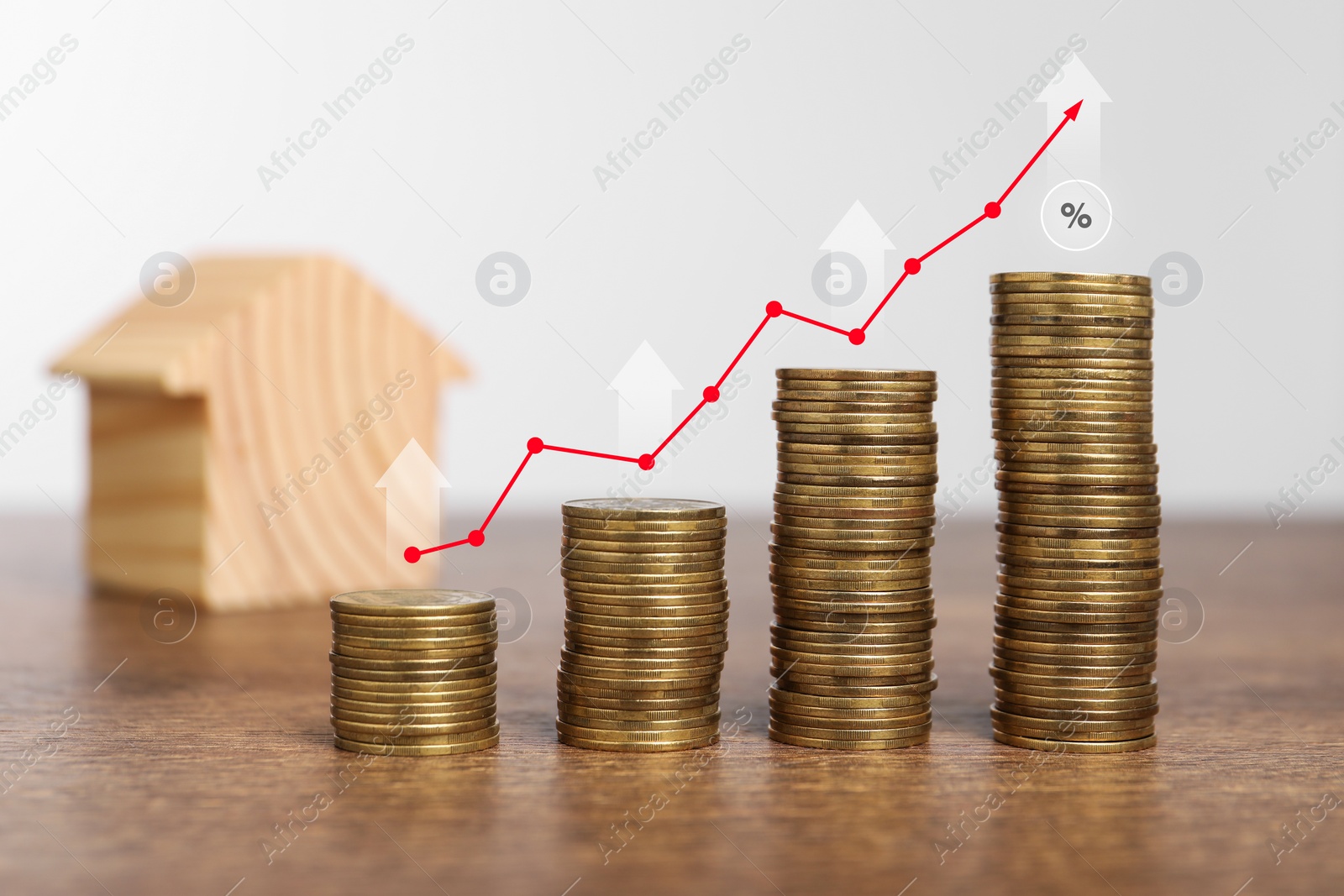 Image of Mortgage rate. Stacked coins, arrows, graph and model of house