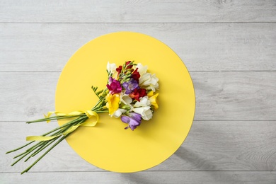 Photo of Beautiful freesia bouquet on table