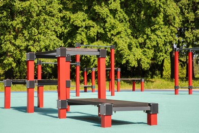 Photo of Empty outdoor gym with exercise equipment in park