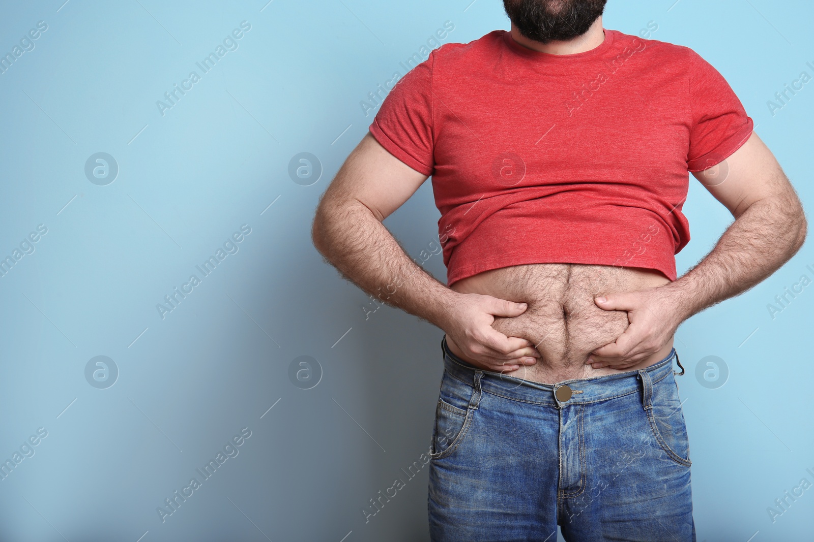 Photo of Overweight man on color background