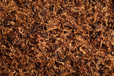 Photo of Pile of dry tobacco as background, closeup