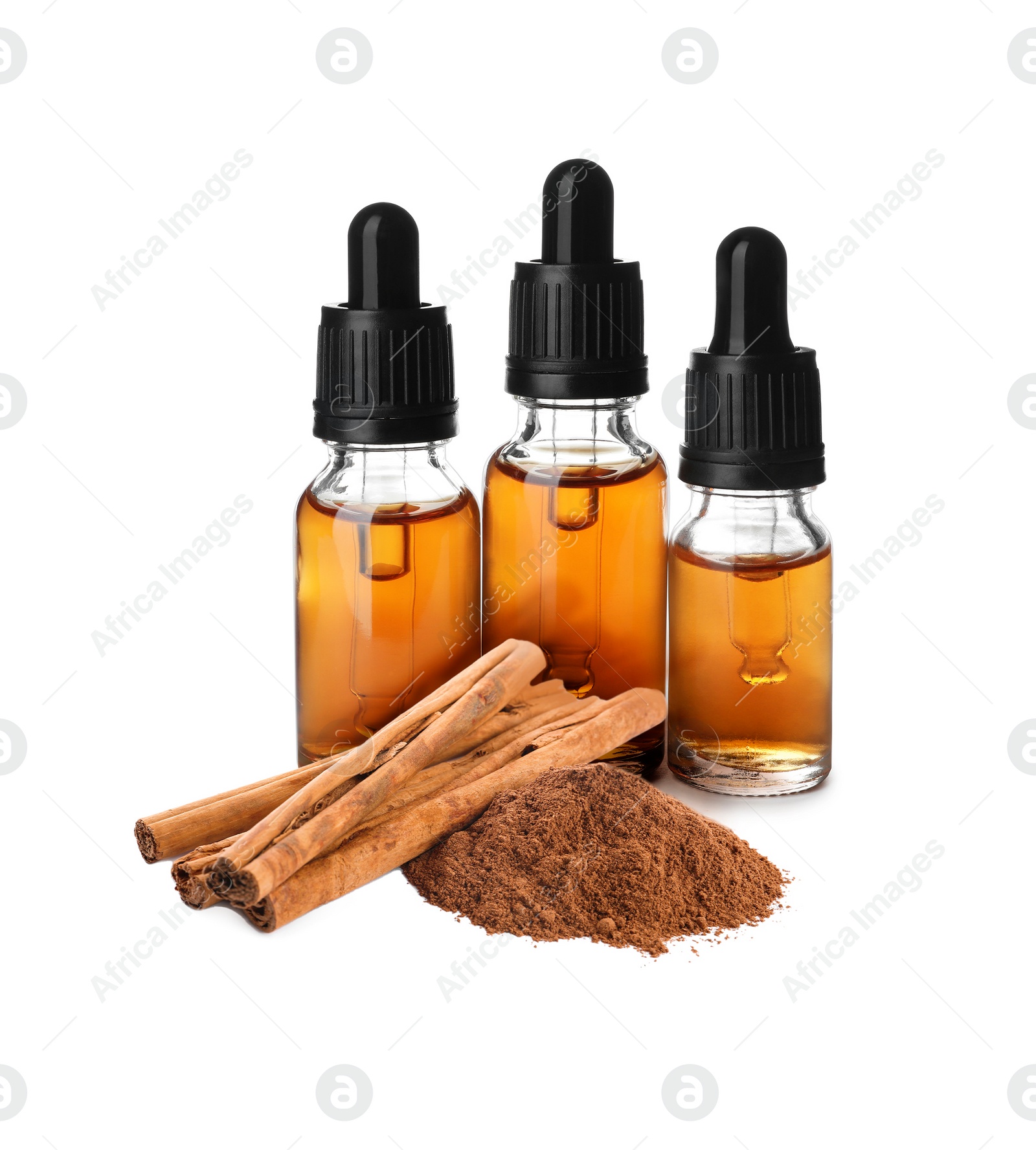 Image of Bottles of natural essential oil, dry cinnamon sticks and powder on white background