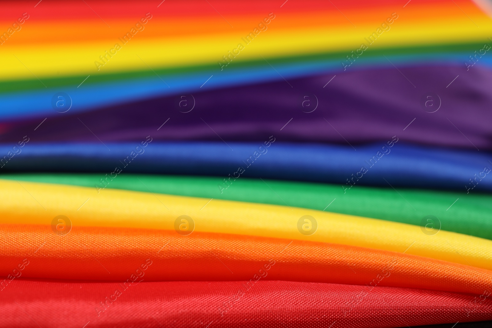 Photo of Rainbow LGBT flag as background, closeup view