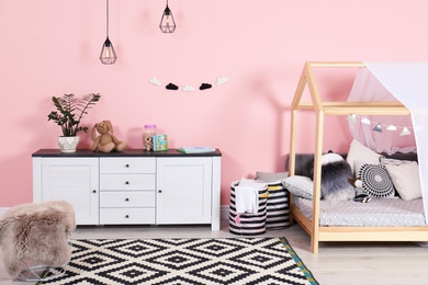 Photo of Modern child's room interior with cute bed