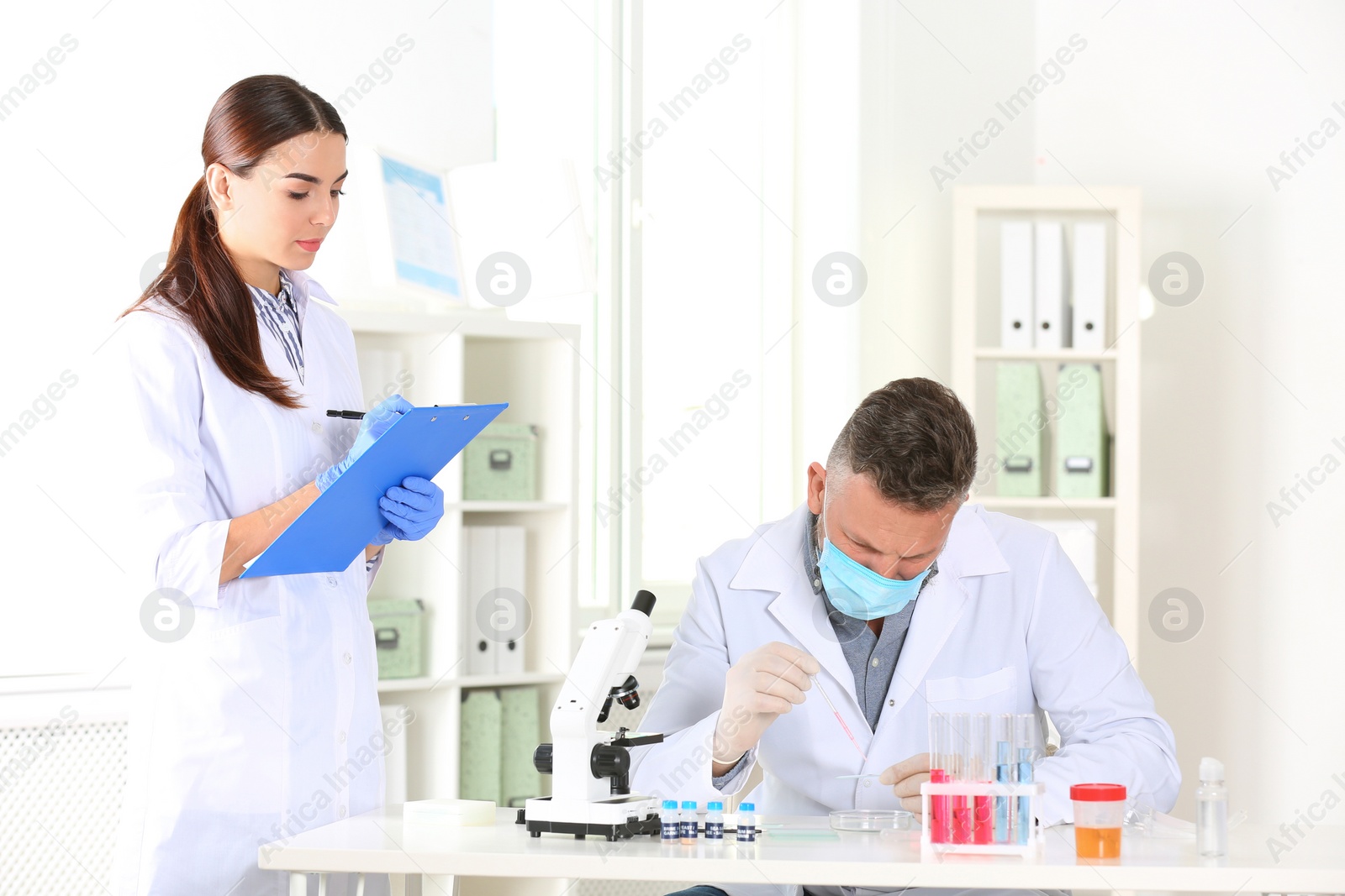 Photo of Scientists working in laboratory. Research and analysis