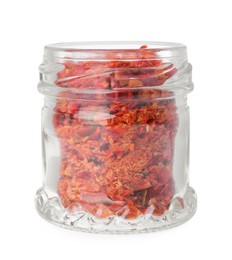 Photo of Aromatic spice. Red chili pepper flakes in jar isolated on white