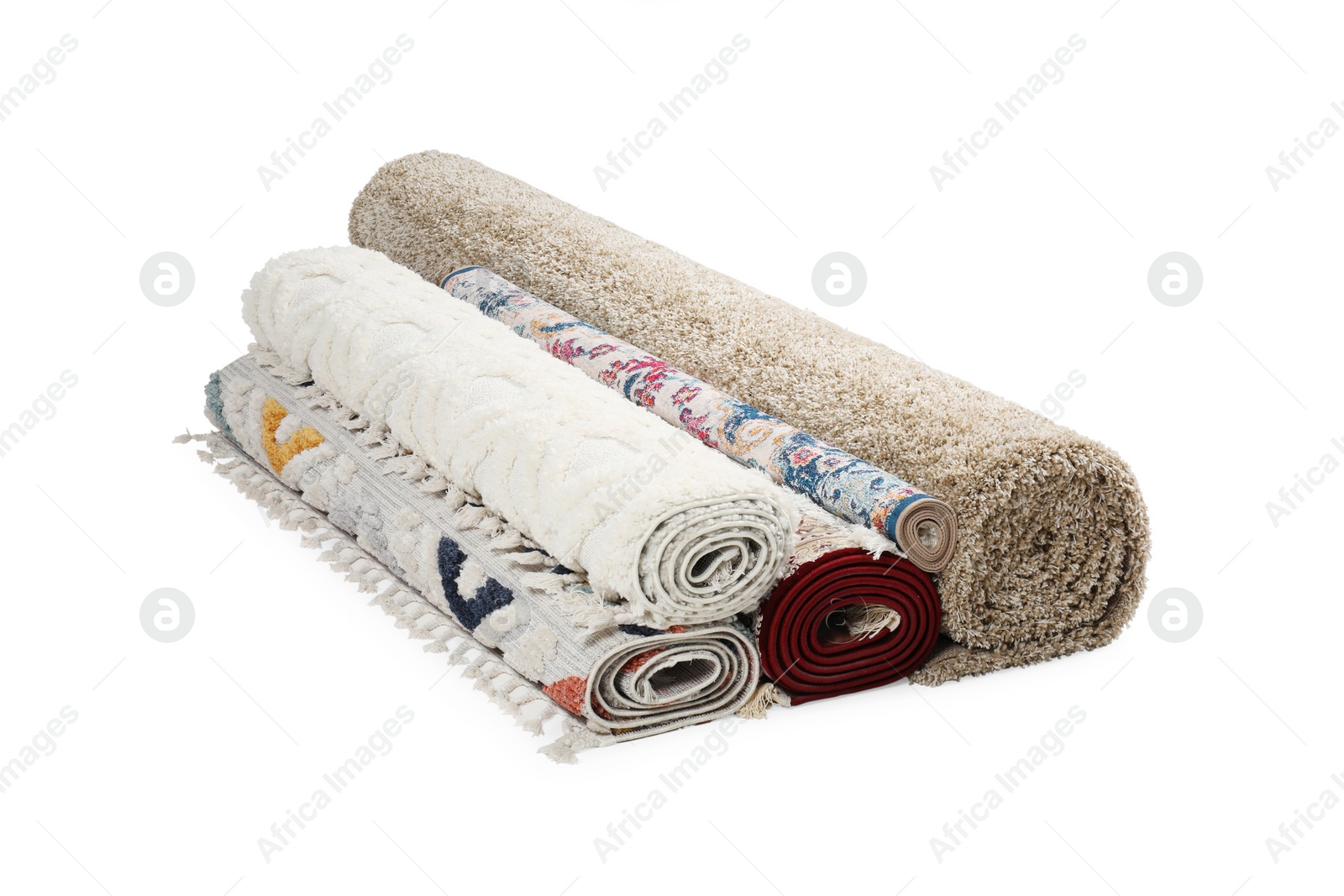 Photo of Rolled carpets on white background. Interior element