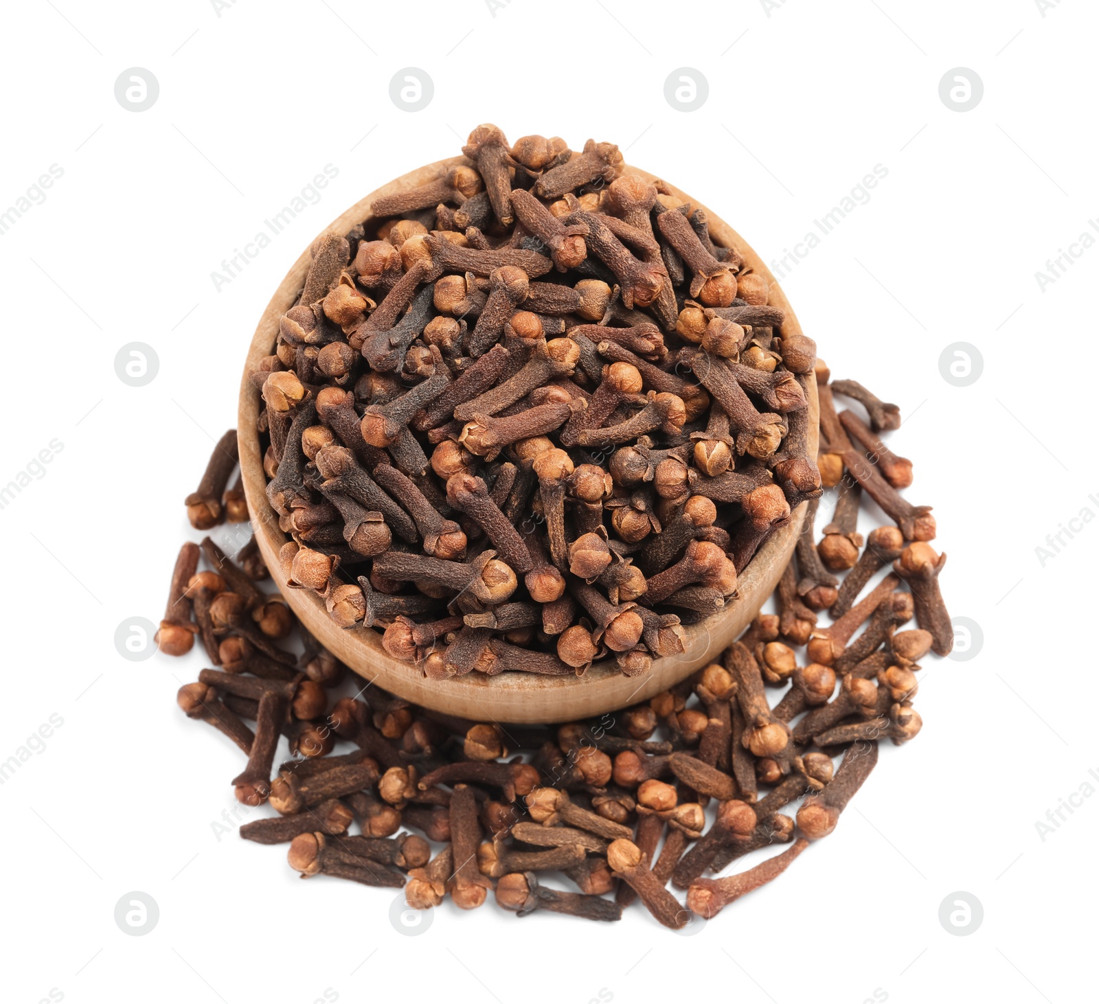 Photo of Aromatic dry cloves and wooden bowl on white background, top view