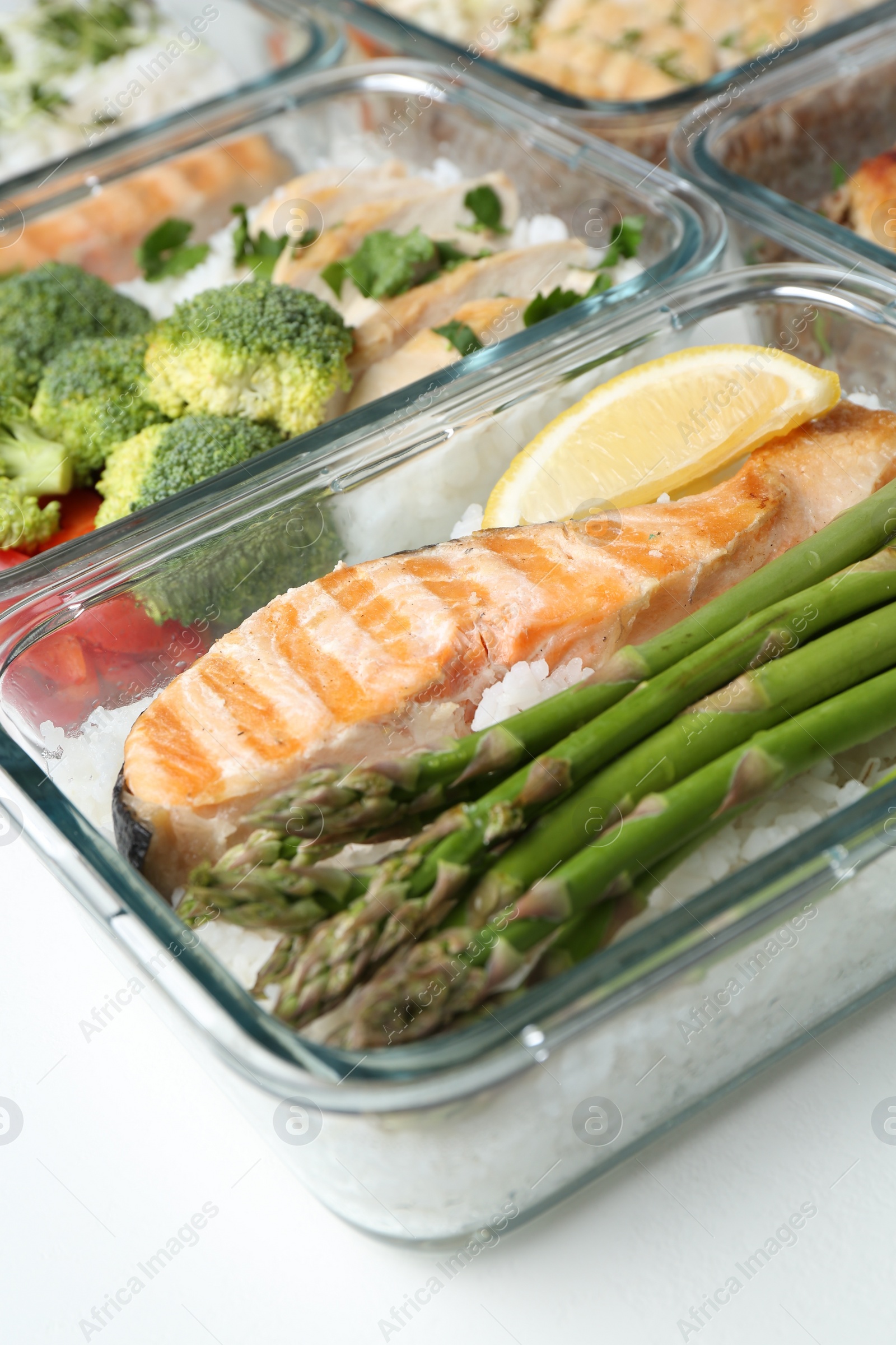 Photo of Healthy food. Different meals in glass containers on white background, closeup