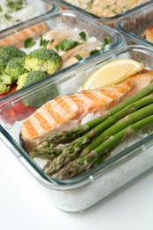 Healthy food. Different meals in glass containers on white background, closeup