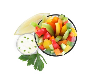 Photo of Different vegetables cut in sticks and bowl with dip sauce on white background, top view