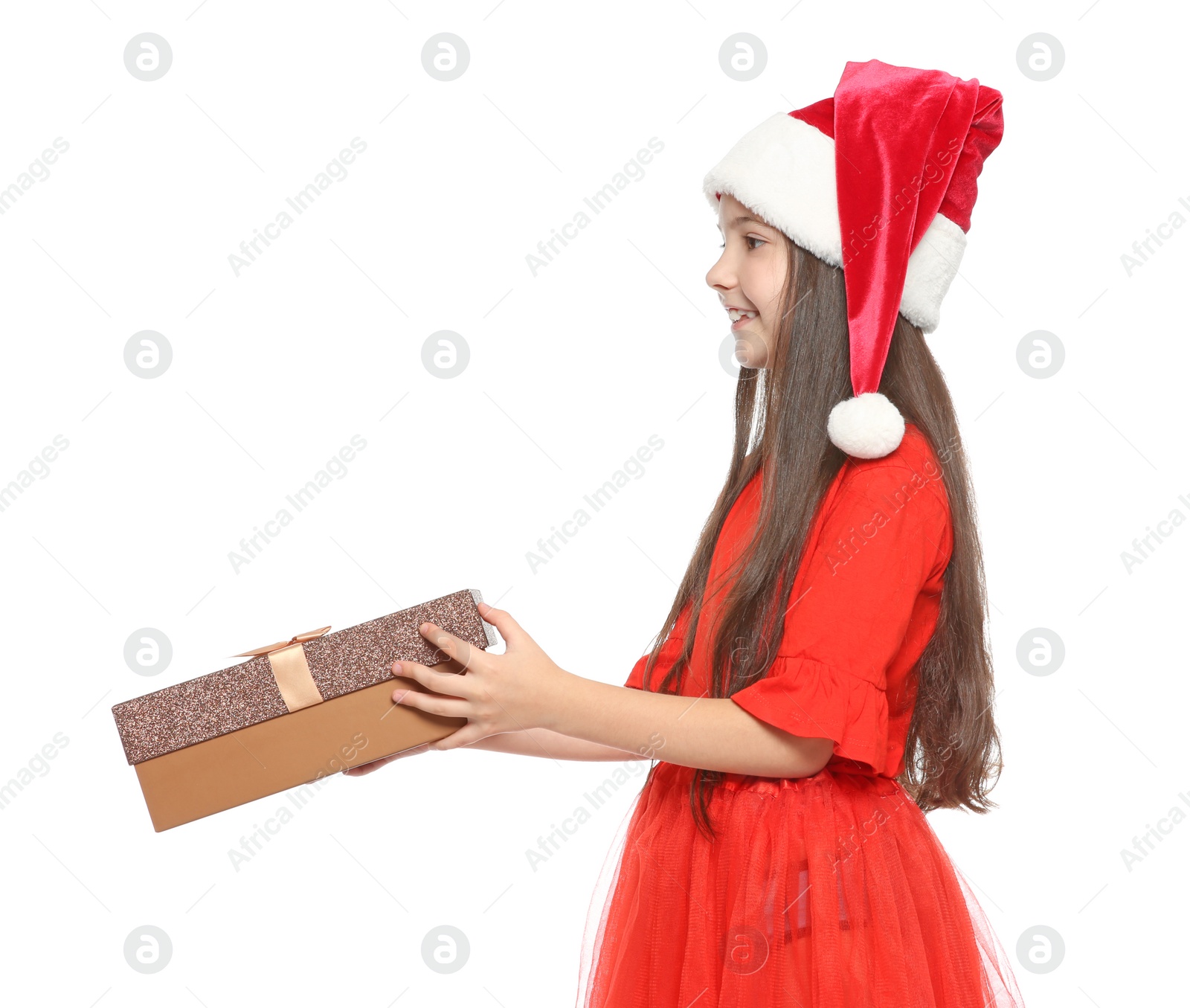 Photo of Cute little child in Santa hat with Christmas gift box on white background