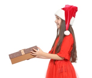 Photo of Cute little child in Santa hat with Christmas gift box on white background