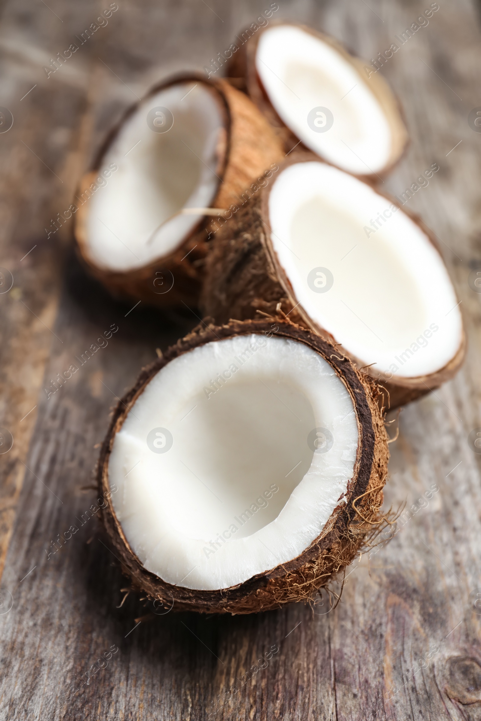 Photo of Fresh yummy coconuts on wooden table