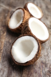 Fresh yummy coconuts on wooden table